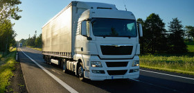 Truck on the road, star shining rays of the sun.