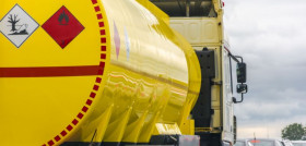 yellow fuel tank standing in a traffic jam