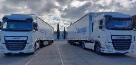 Imagen de camiones estacionados en paralelo con lona okcargo
